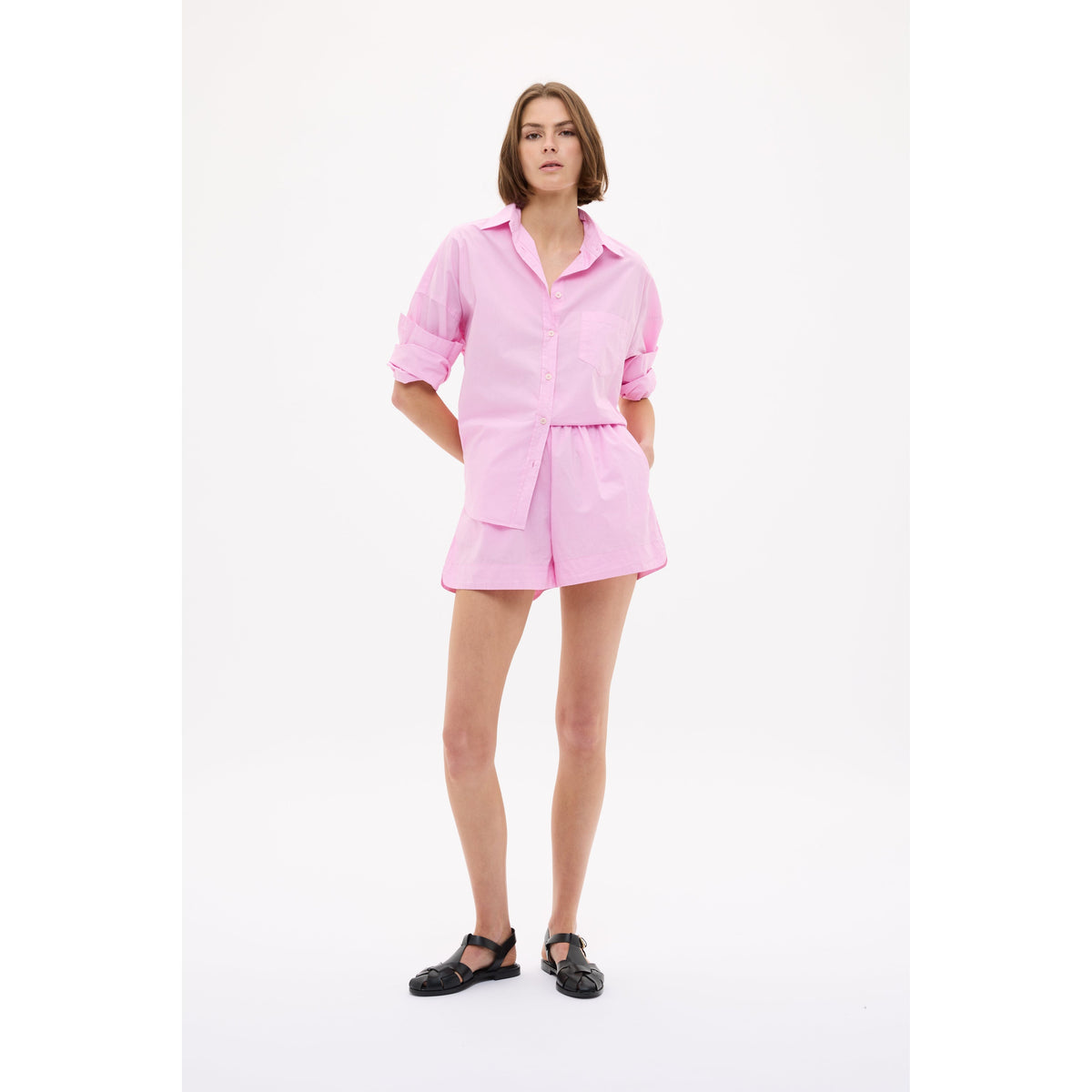 Women's Chiara Shirt in Rose Glow by LMND, featuring soft fabric and stylish design, displayed on a hanger.
