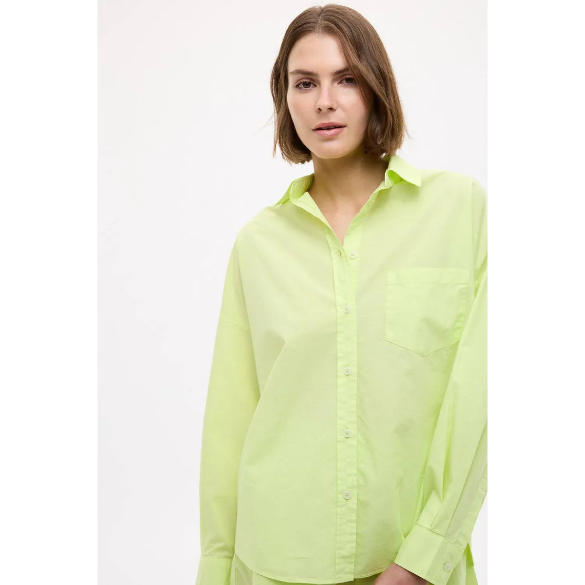 Women's Chiara Sunny Lime shirt by LMND, featuring a vibrant lime-colored fabric with a relaxed fit and stylish design.
