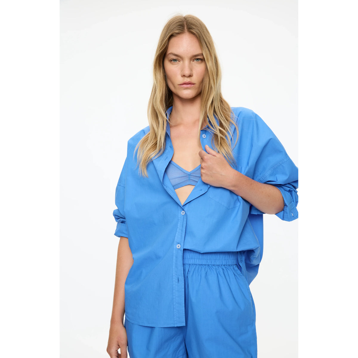 Women's Chiara Shorts by LMND in ink blue, with a close-up of the stylish denim fabric and tailored fit.