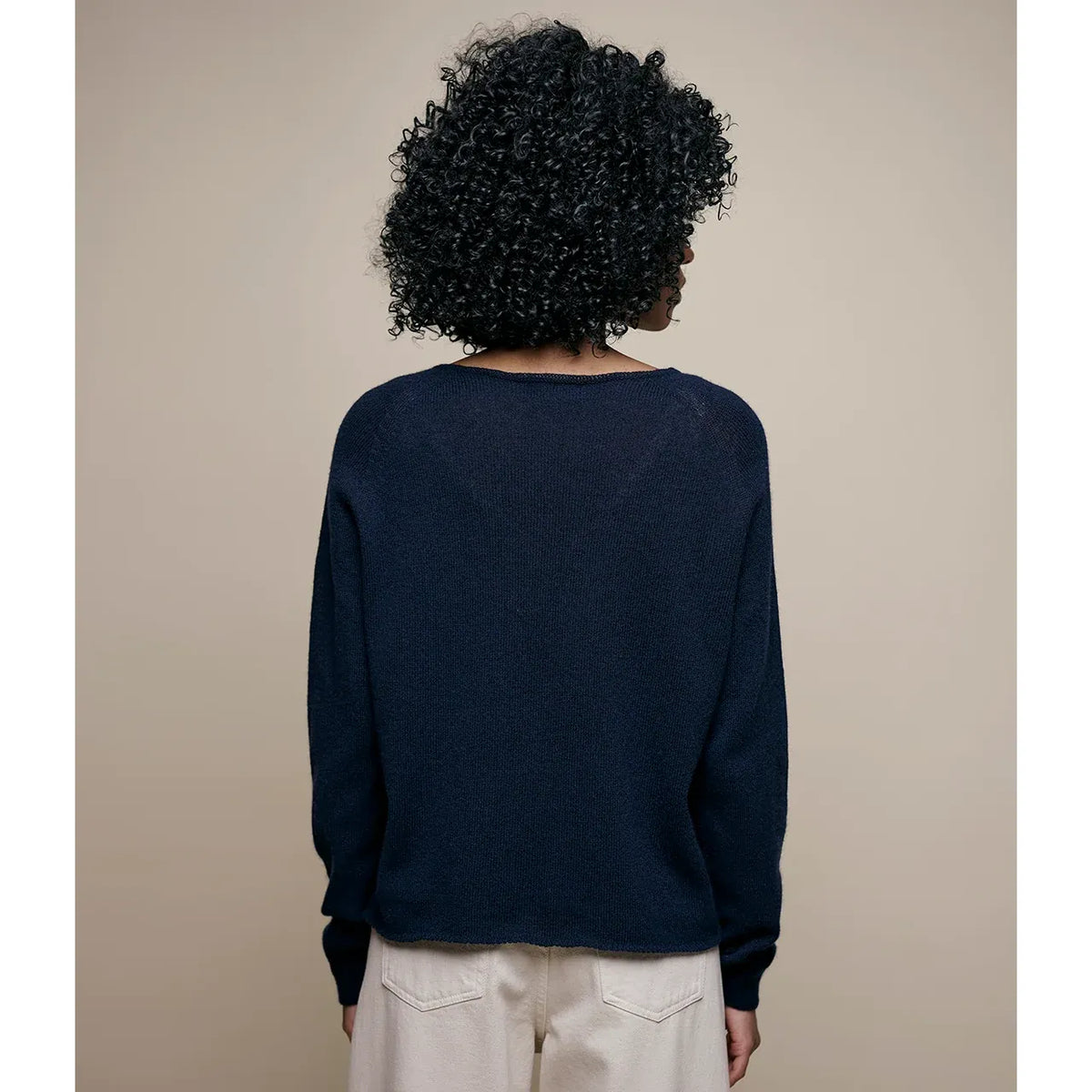 Women's lightweight Merz b. Schwanen Merino wool, cashmere, and silk crewneck sweater in dark navy, shown on a model.