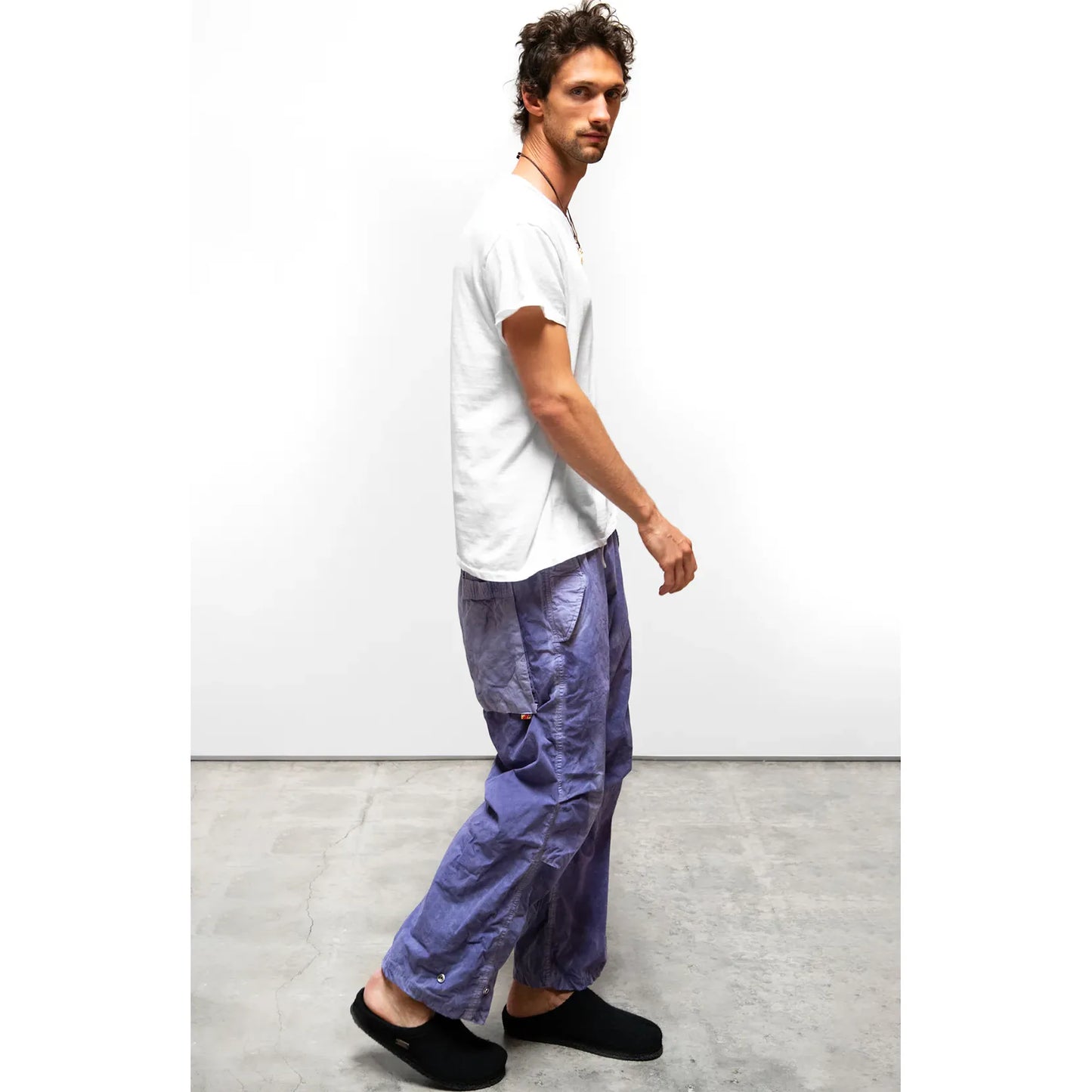 Women's Freecity OUTOFSIGHT poplin kite pant with air flap and snap closure in blue plant fabric, styled for spring.