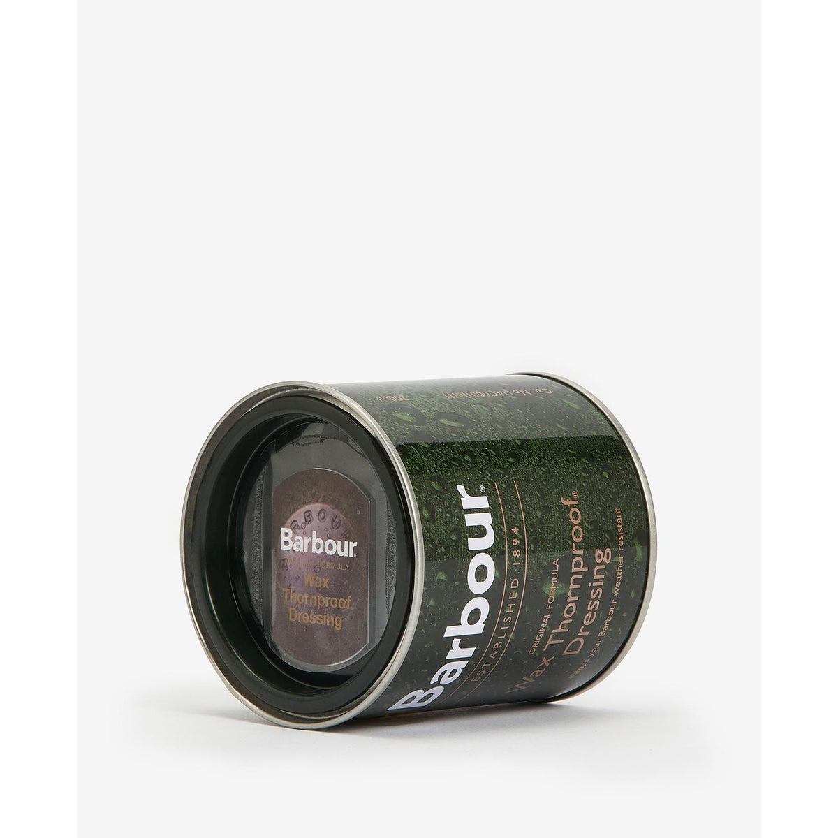Barbour Thornproof Dressing accessory container with applicator brush, designed for waterproofing and protecting outdoor clothing.