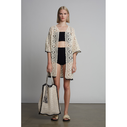 Ivory Vera crochet tote bag with black tipping and tassel details, stylish women's bag by ELEVEN SIX.