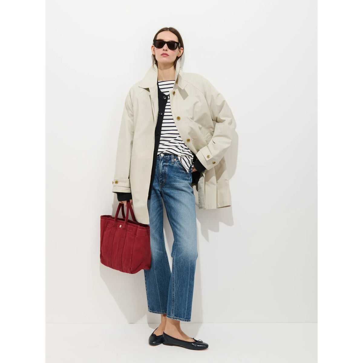 Women's Madeleine Trench coat in cotton blend with stone color, by Alex Mill, shown on a hanger with a neutral background.