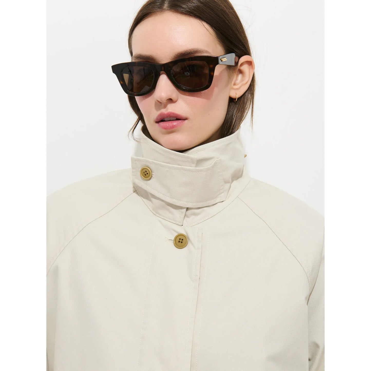 Women's Madeleine Trench Coat in cotton blend by Alex Mill, stone color, front view showing classic silhouette and button details.
