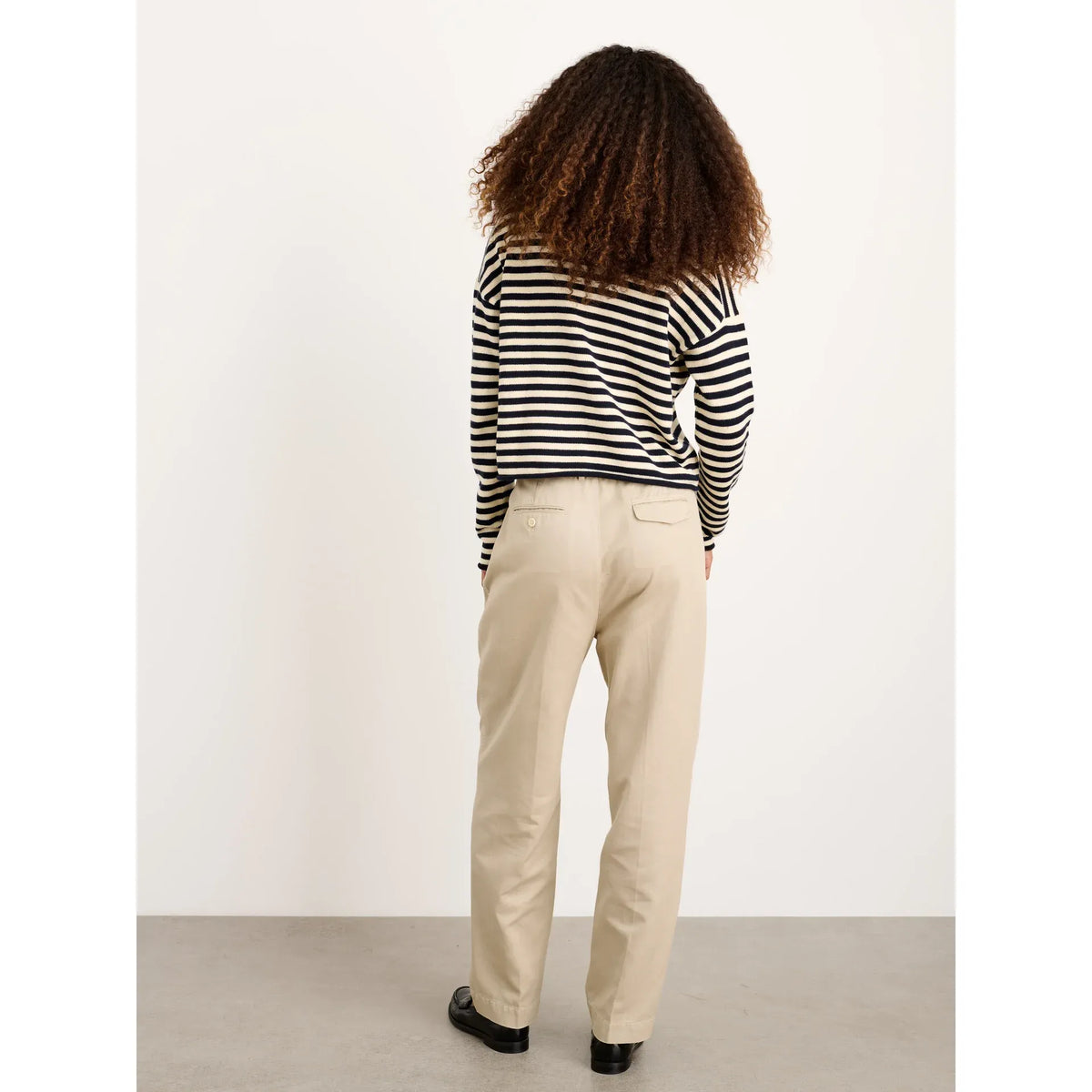 Women's navy and ivory striped cotton cashmere Taylor cardigan by Alex Mill, shown on a model.