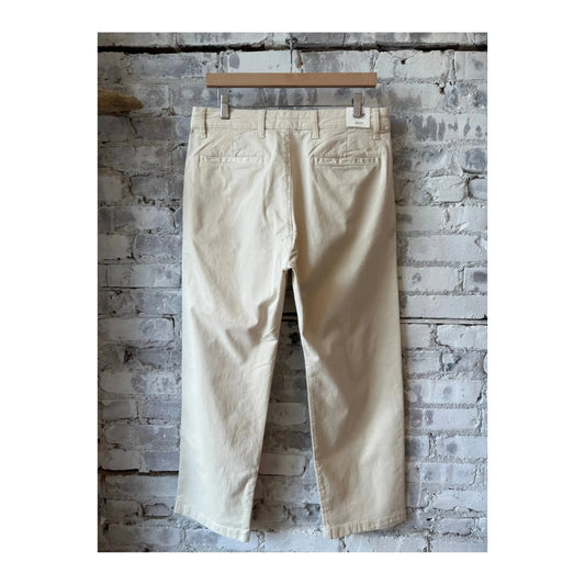 Men's NN07 Aden regular fit ivory chino pants displayed on a hanger, showcasing the clean design and tailored fit.