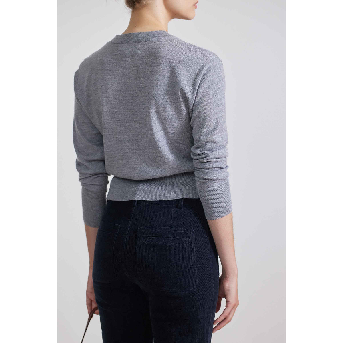 Women's Marston Slim Corduroy Pant in Midnight by Apiece Apart, featuring a close-up of the dark navy corduroy fabric and tailored fit.