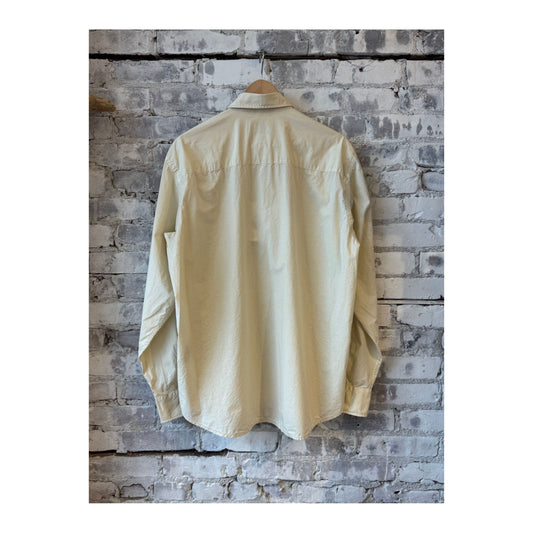 Men's Aspesi Fred garment-dyed shirt in sand color, featuring soft fabric and a classic fit, displayed on a neutral background.