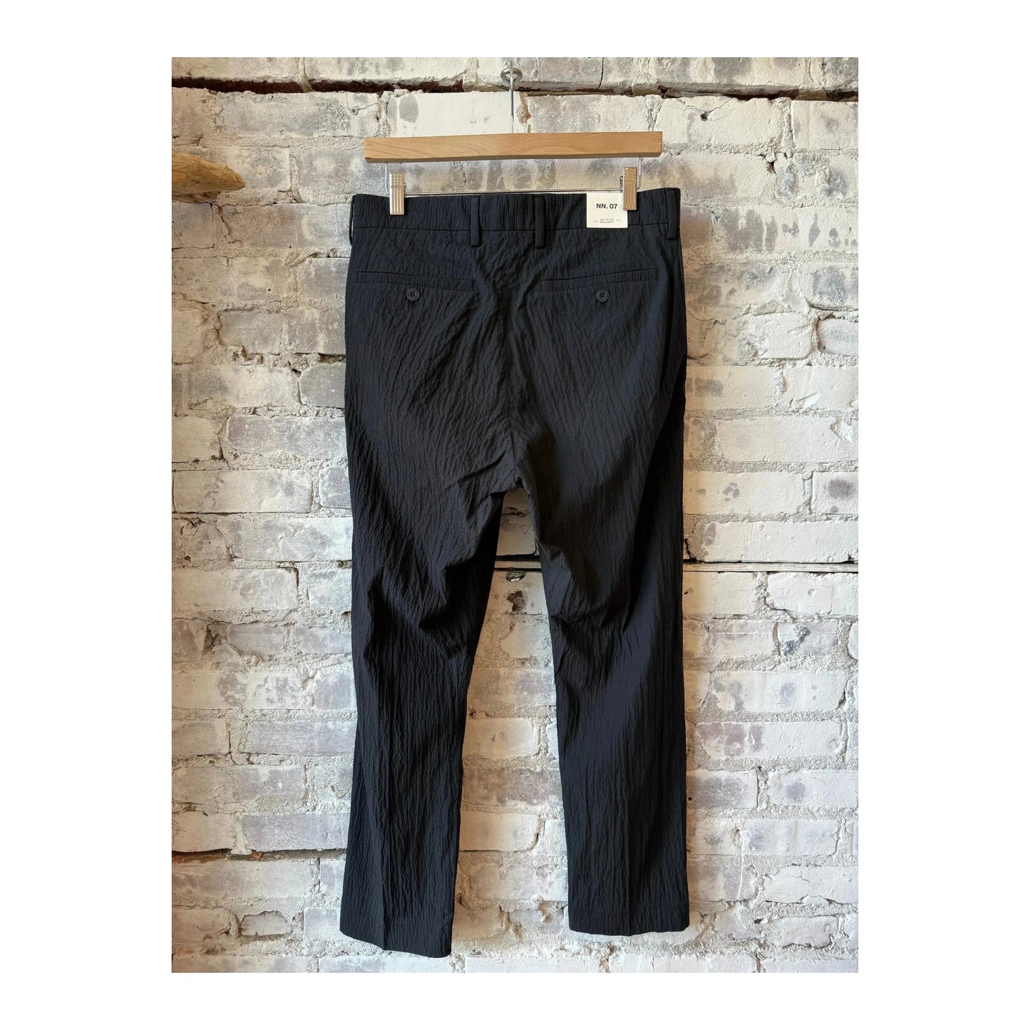 Men's black Bill Seersucker trousers by NN07, featuring a stylish seersucker fabric and classic fit for casual or smart occasions.