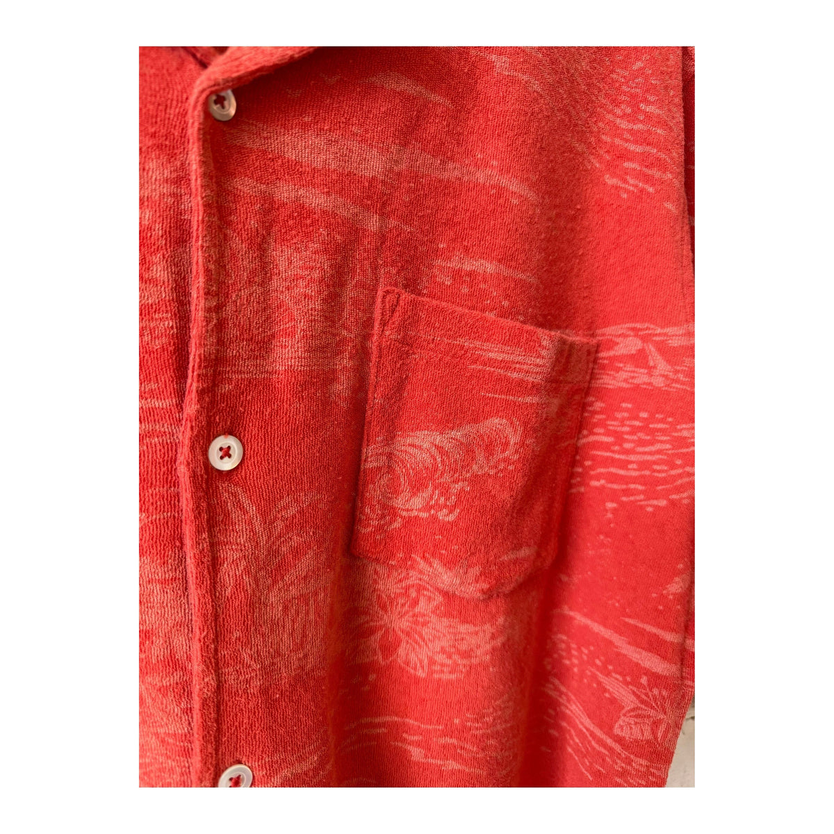 Men's Hartford Bouclette Knit Polo in terracotta, close-up of the textured knit fabric and classic polo collar.
