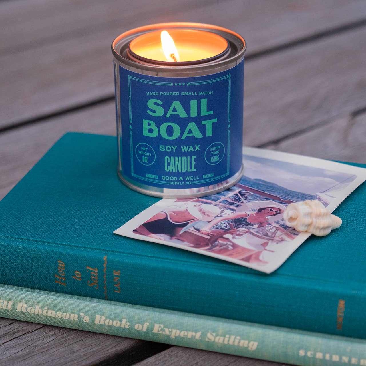 Sailboat soy candle from Good & Well Supply Co. with a nautical sailboat design, ideal for home decor and cozy ambiance.