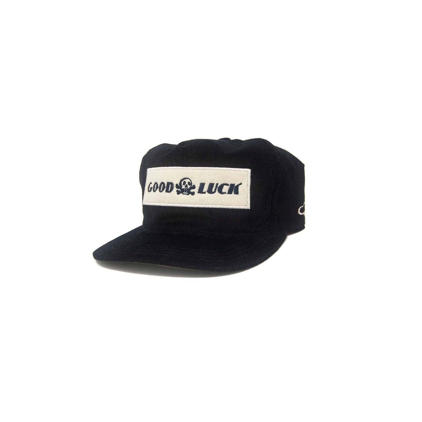 Black snapback hat with "Good Luck" embroidered logo, featuring a flat brim and adjustable strap by The Ampal Creative.