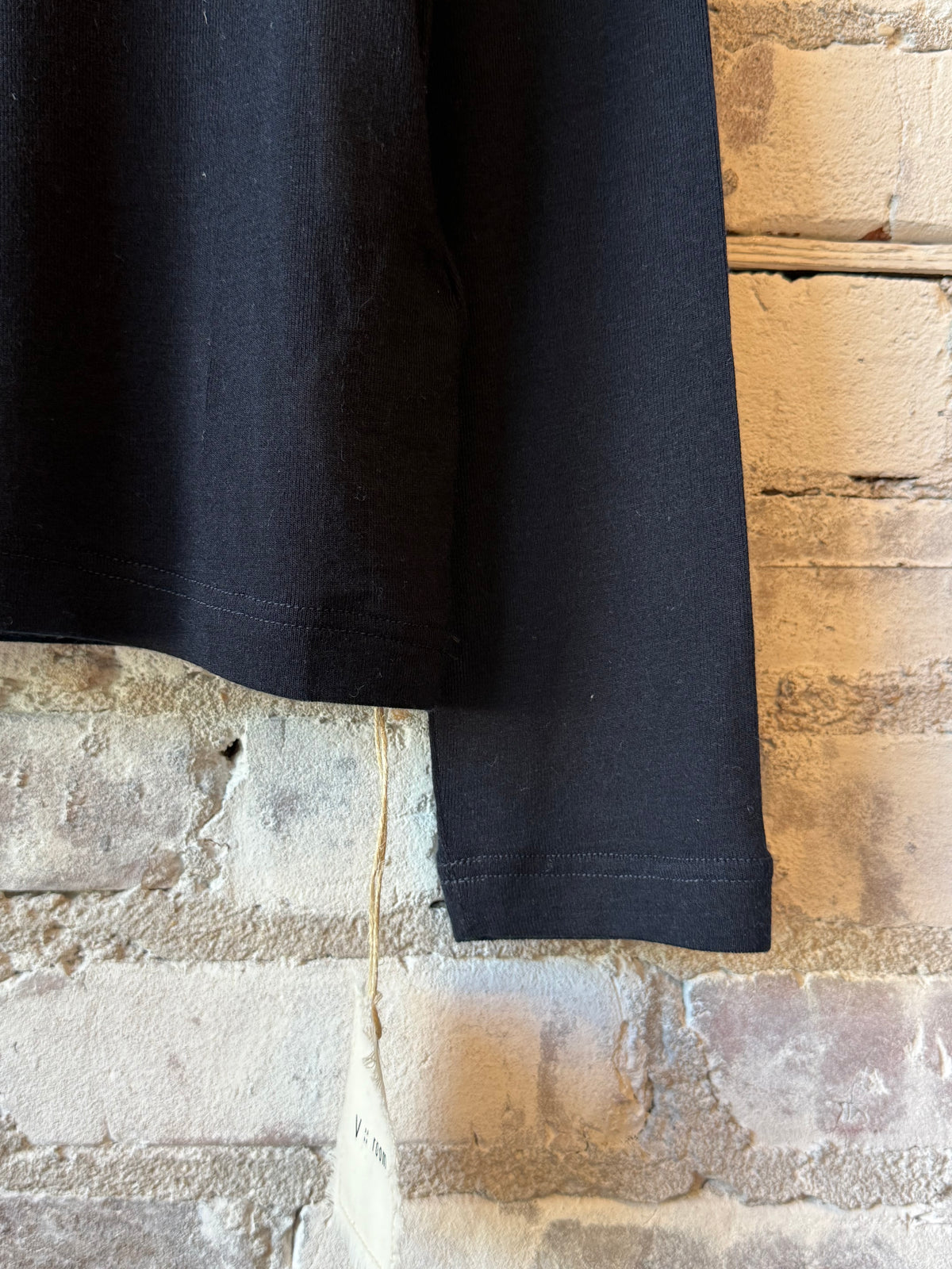 Women's navy cashmere silk jersey long-sleeve crew from V::Room, soft and luxurious knit sweater, close-up of fabric and neckline.
