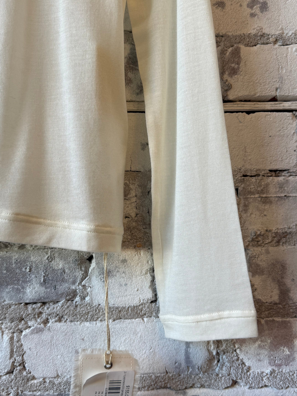 Women's white cashmere silk jersey long-sleeve crew top by V::Room, soft and luxurious fabric with a fitted silhouette.