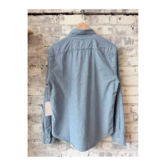 Men's chambray shirt in chambray blue by Save Khaki United, featuring a casual fit and button-down collar.