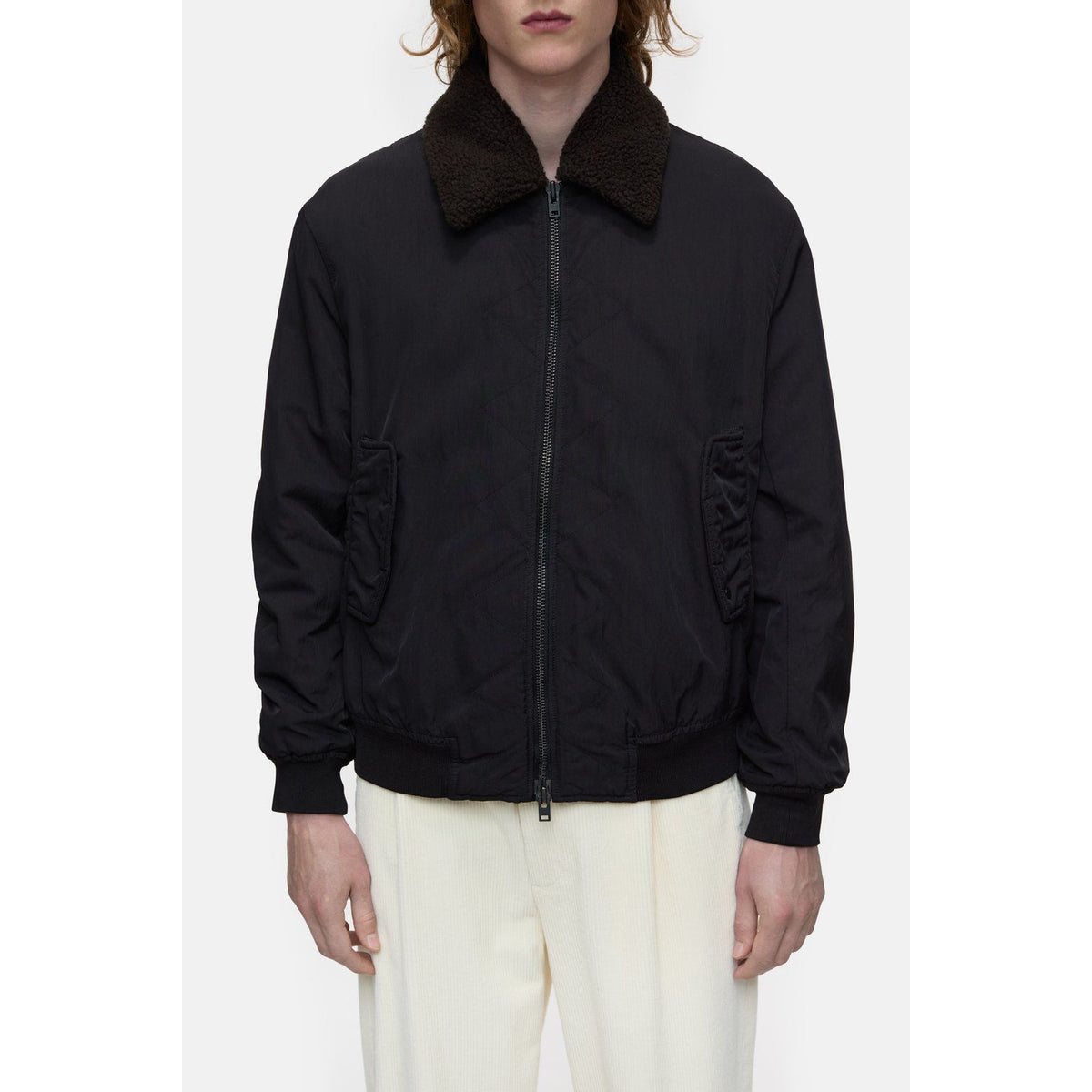 Men's nylon flight jacket by Closed, in ebony color, featuring a sleek design with a stand collar and front zip closure.