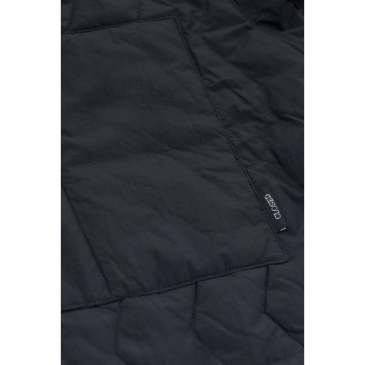 Men's black quilted jacket by Closed Men's, featuring a padded design and stylish fit, suitable for cold weather.