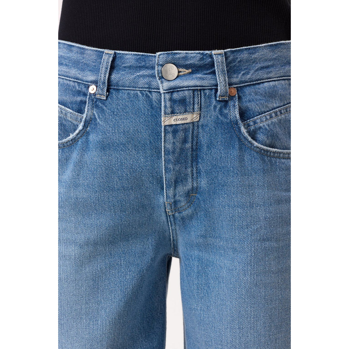 Women's Nikka Wide Jeans in mid blue by Closed, shown on a model, featuring a relaxed fit and classic denim style.