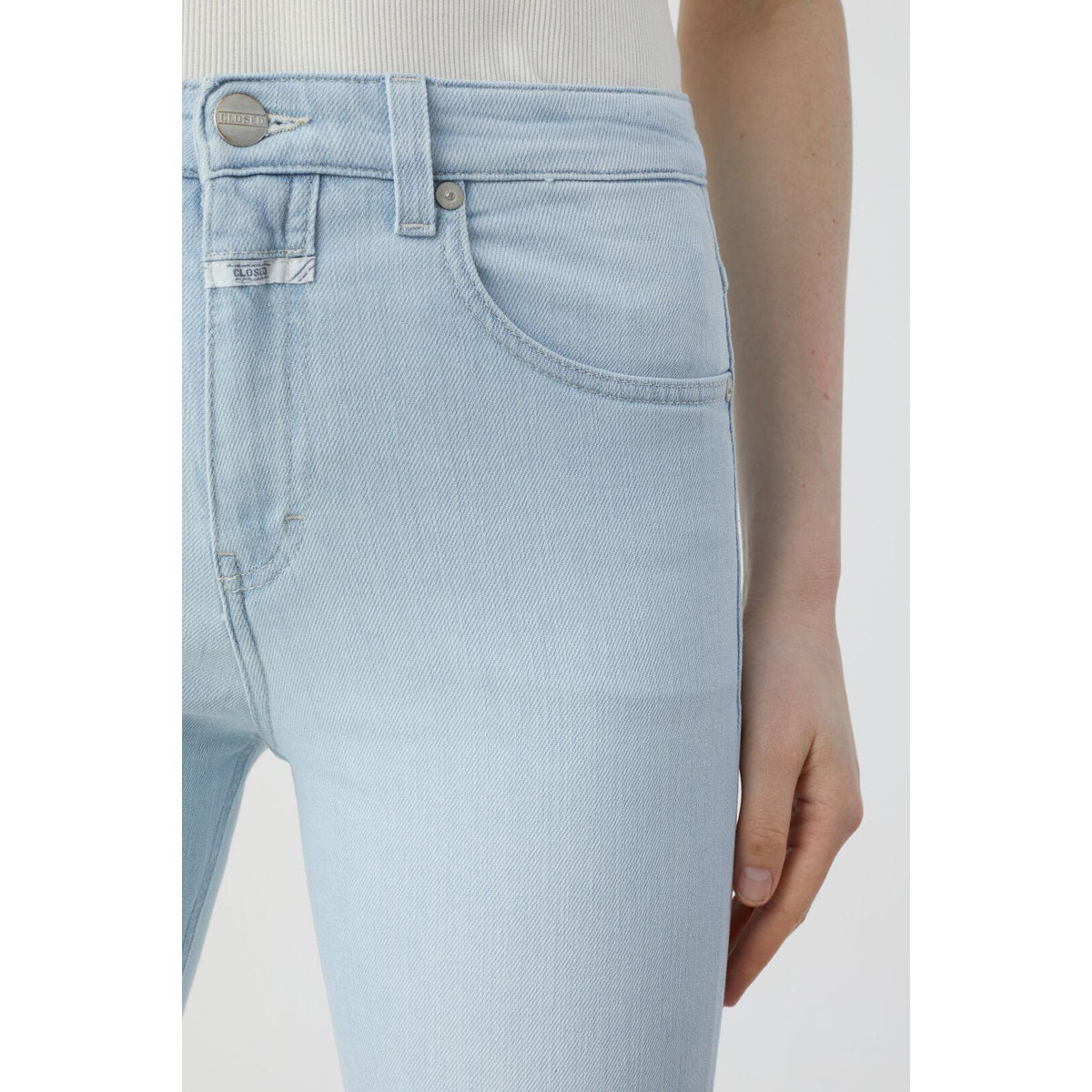 Light blue Rawlin denim jeans for women by Closed Women's, shown in a casual pose highlighting the fit and denim fabric.