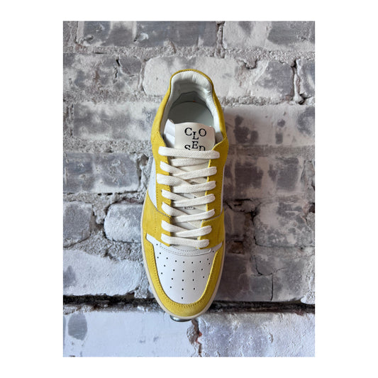 Women's Closed Women's primary yellow low-top sneaker with a sleek design and comfortable fit.