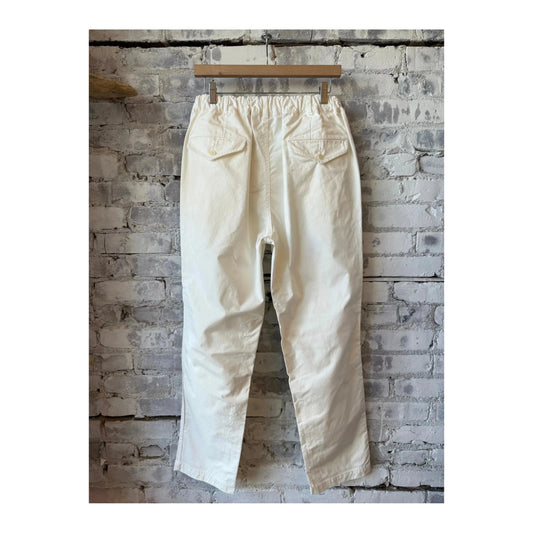 Men's off-white cotton chino cloth peg top pants by Sage De Cret, showing the relaxed fit and stylish design.