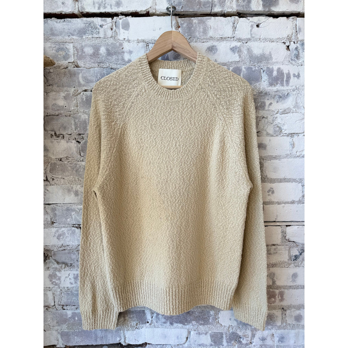 Men's cotton jumper in whipped cream color by Closed Men's, featuring a cozy, casual knit design and ribbed cuffs.