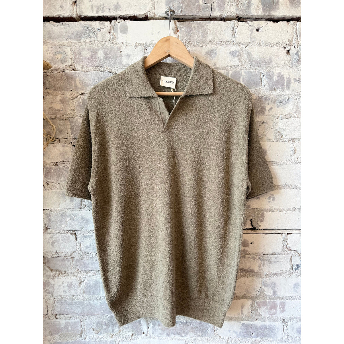 Men's cotton knit polo in pebble green by Closed Men's, featuring a classic collar and short sleeves.