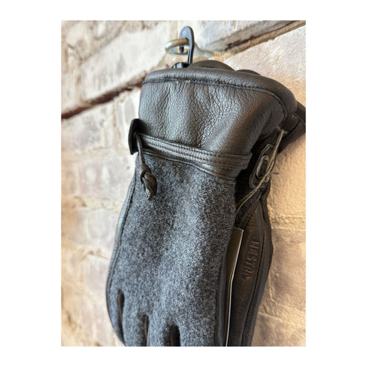 Men's Hestra Daniel Leather Gloves in charcoal and black, showing the stylish leather construction and snug fit design.