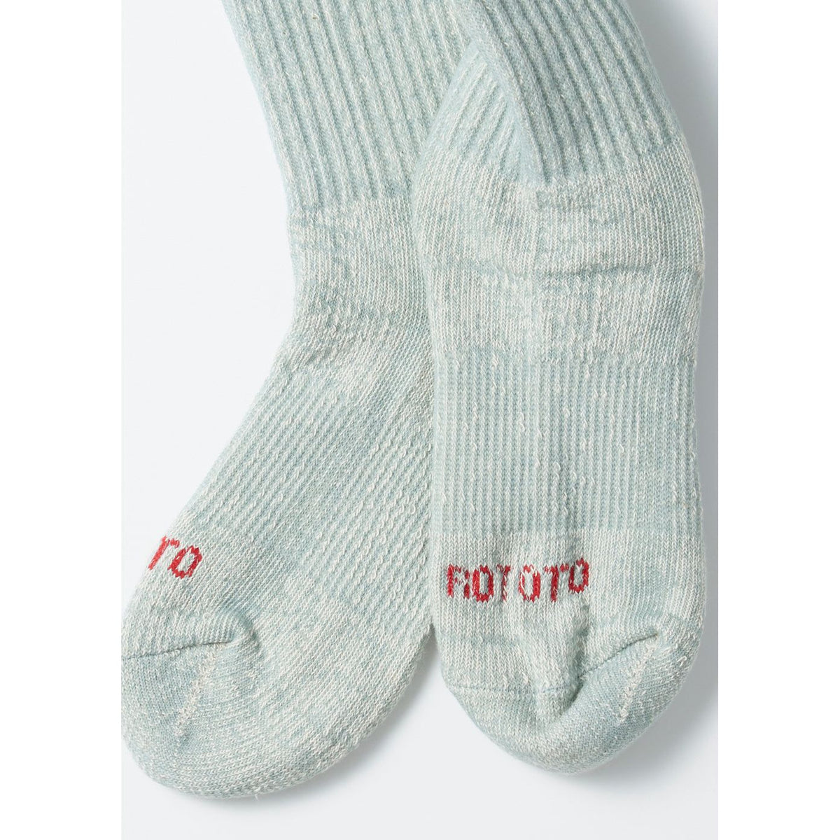 Men's light blue double face organic cotton mini crew socks by Rototo, showing a close-up of soft, breathable fabric and ribbed cuffs.
