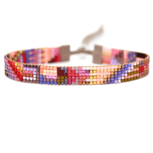 Colorful Bermuda bracelet by Julie Rofman featuring woven fabric and bead accents, perfect for stylish accessories.