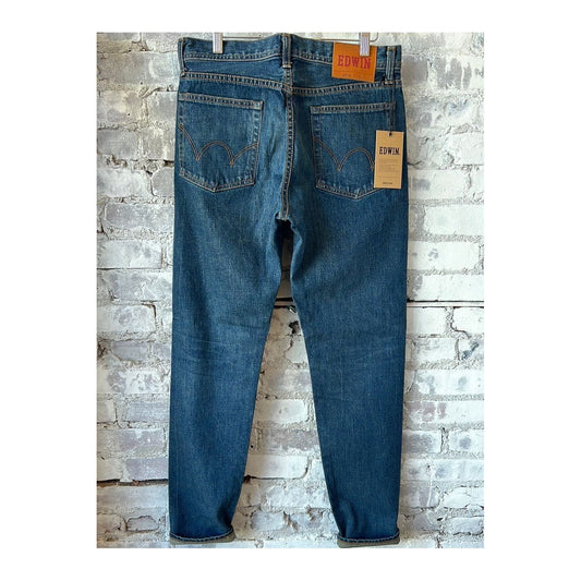 Men's Edwin Akita Regular Taper 13.5oz Rainbow Selvedge jeans in 180 Day Dark Wash, showing the dark denim fabric and tapered fit.