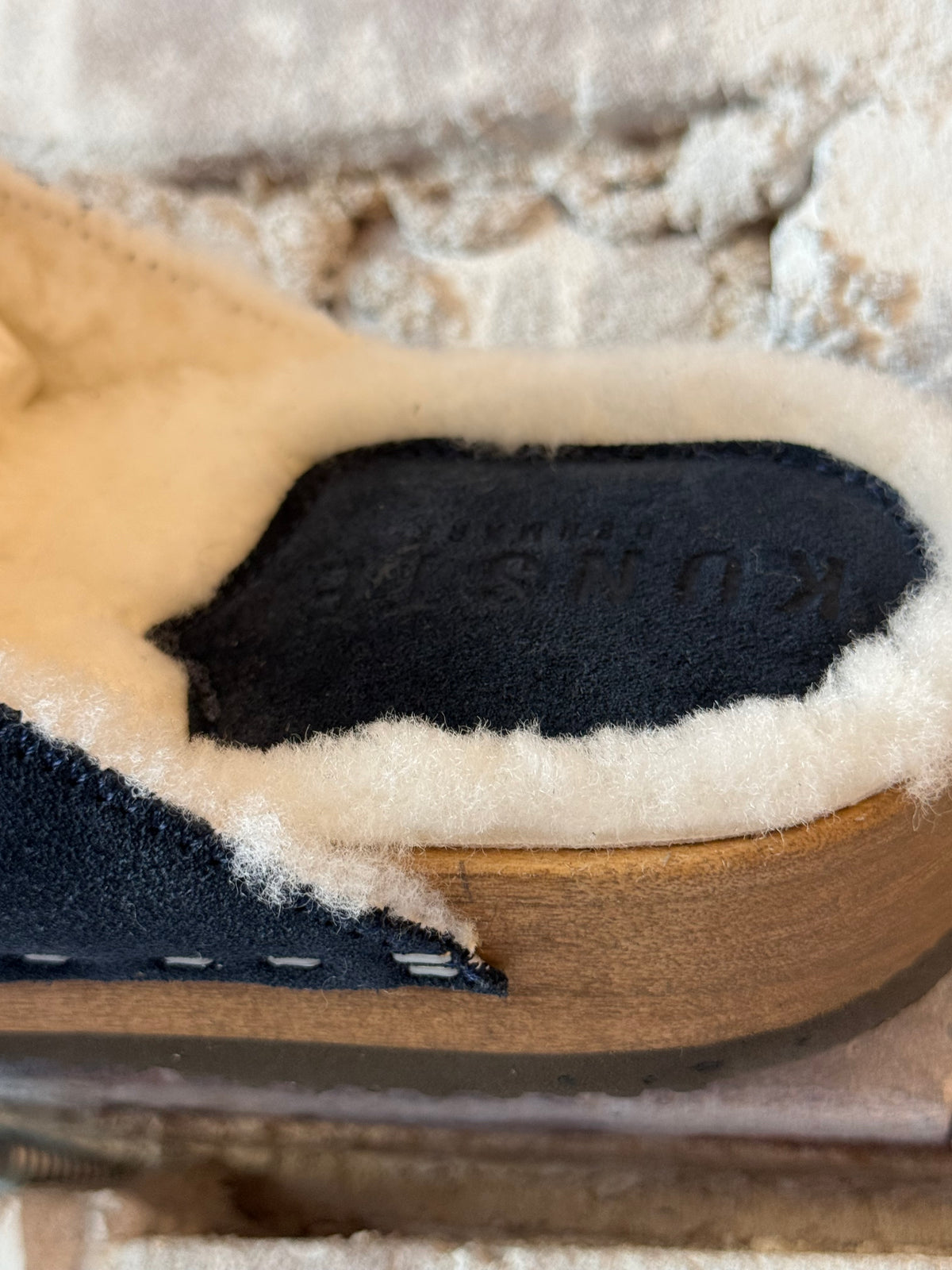 Women's Ella Suede and Lambswool Clogs in navy and white by Kunsten Clogs, featuring a stylish slip-on design and cozy materials.