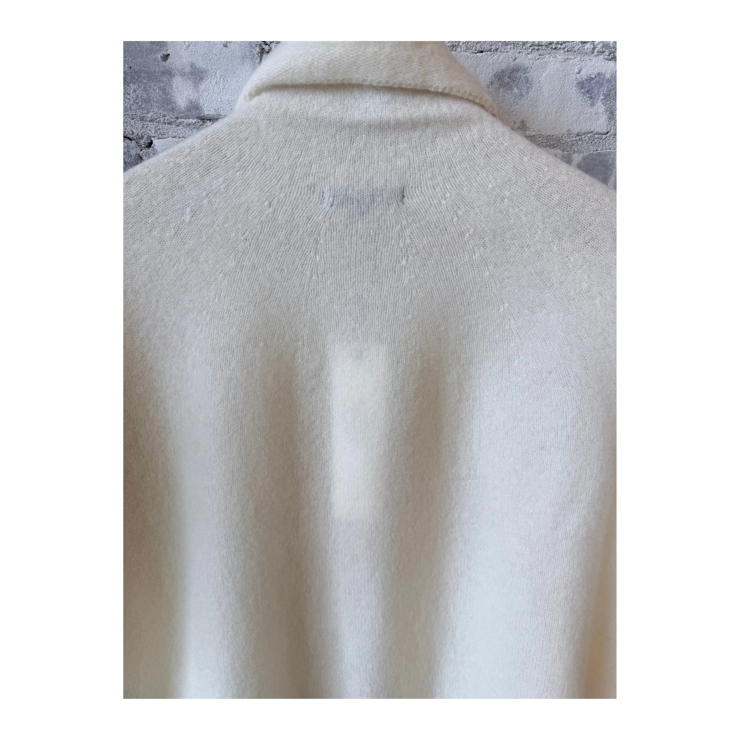Women's ivory fine wool turtleneck pullover by Pas De Calais, featuring a cozy fit and classic design.