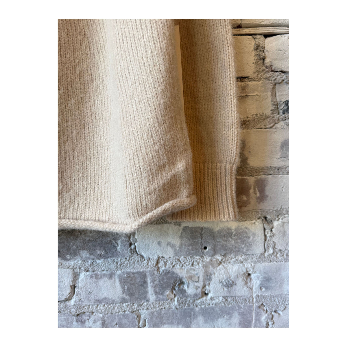 Cream women's handloom rollneck sweater by Bare Knitwear, featuring a cozy, textured knit design.