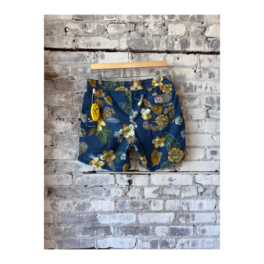 Men's navy swim trunks with hibiscus print made from recycled nylon by Hartford Men's, featuring a vibrant floral design.