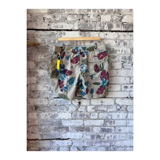 Men's Hartford Hibiscus printed recycle nylon swim trunks in sand color with hibiscus floral pattern, front view.