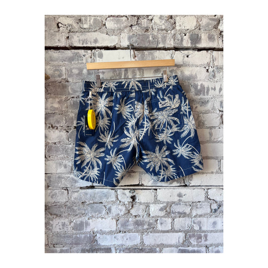 Men's navy swim trunks with palm print from Hartford Men's made of recycled nylon, featuring a comfortable fit and vibrant design.