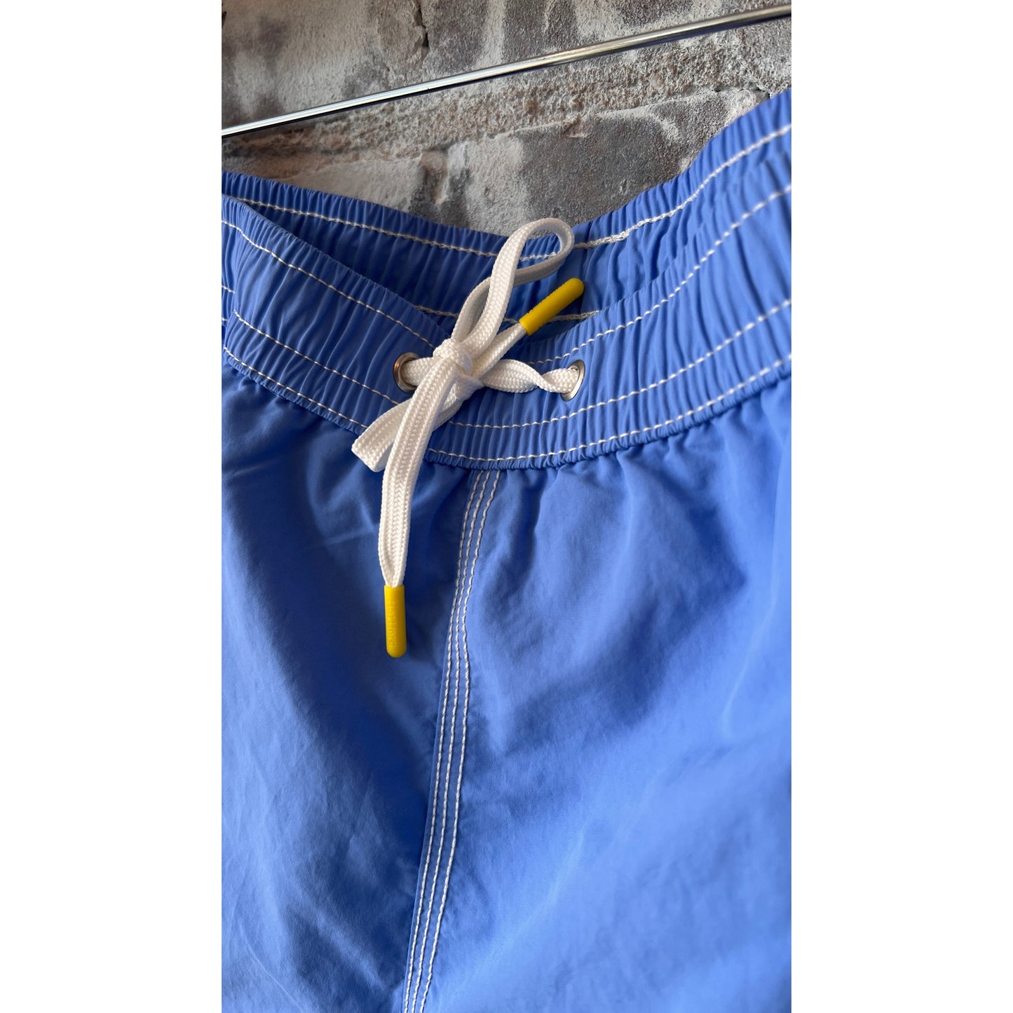 Men's Hartford Classic Sea Blue swim shorts with an elastic waistband and side pockets, displayed laid flat.