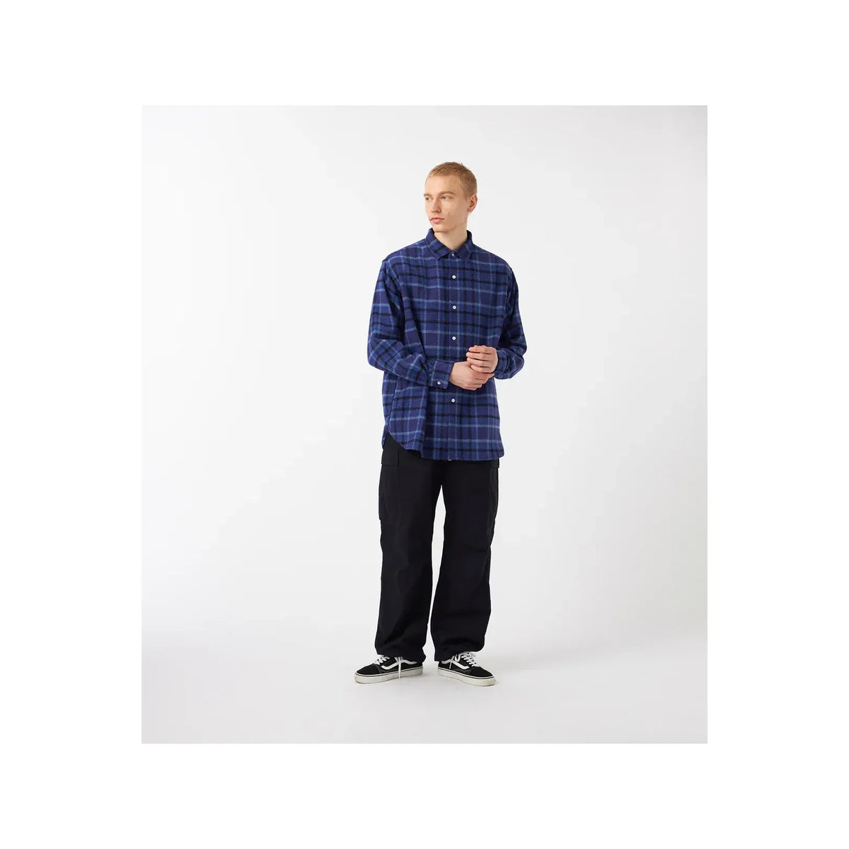 Men's heavy flannel shirt by nanamica in beige and gray plaid, featuring a classic button-up design and warm, soft fabric.