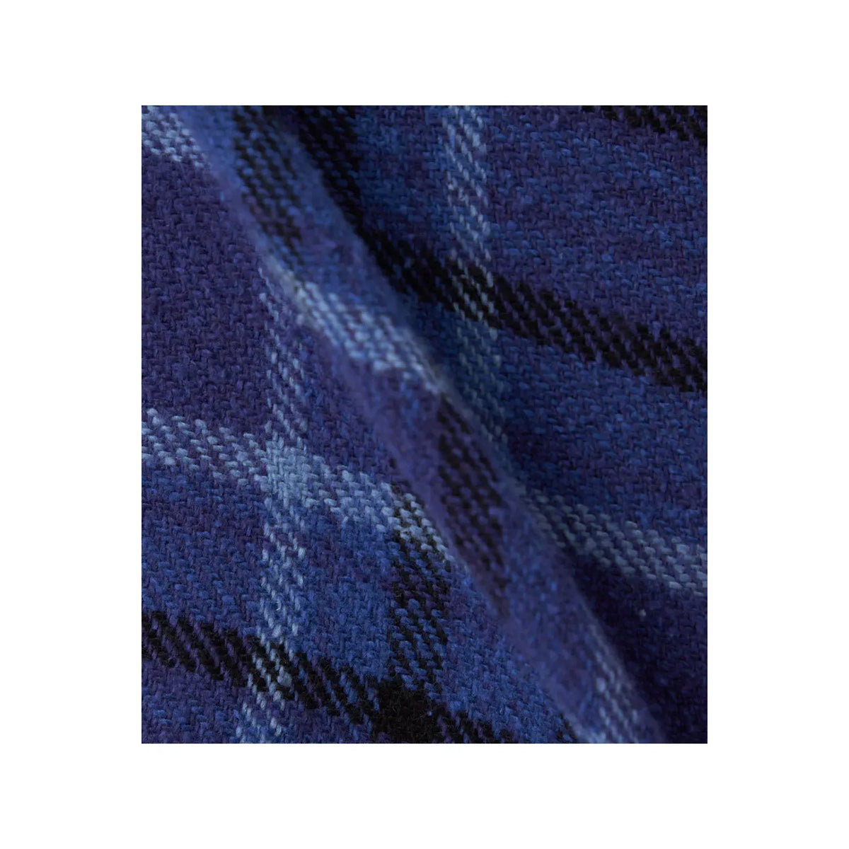 Men's beige and gray plaid flannel shirt by nanamica, featuring a classic heavy flannel fabric and button-down style.