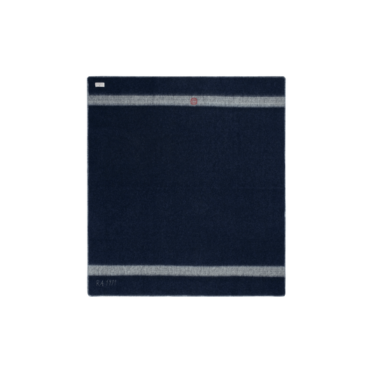 Amundsen Herdsman Blanket in faded navy, cozy woven accessory with fringe edges, perfect for stylish warmth and comfort.