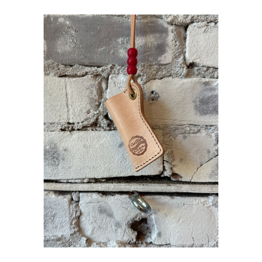Natural leather lighter pouch by Girls of Dust, stylish accessory with a sleek design, perfect for carrying a lighter securely.