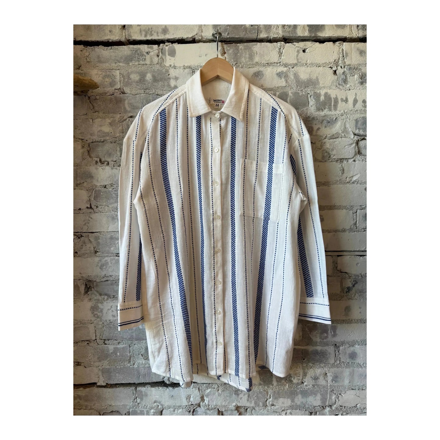 LemLem Mariam Shirt Dress in Tiki Azure, women's lightweight dress with a relaxed fit and vibrant blue pattern, displayed on a hanger.
