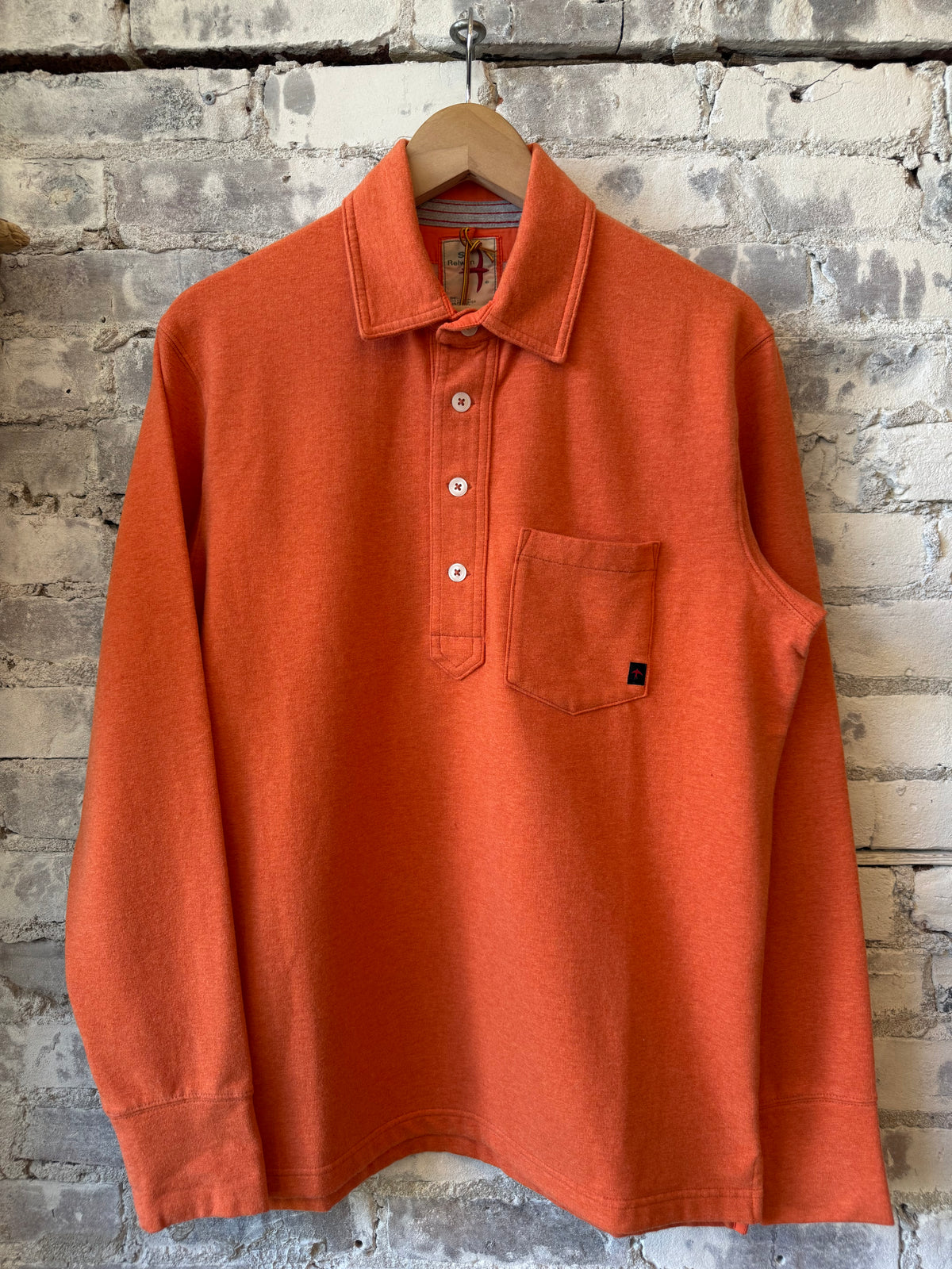 Men's Relwen Mariner Polo in orange fade heather with a classic collar and short sleeves, showcasing casual style.