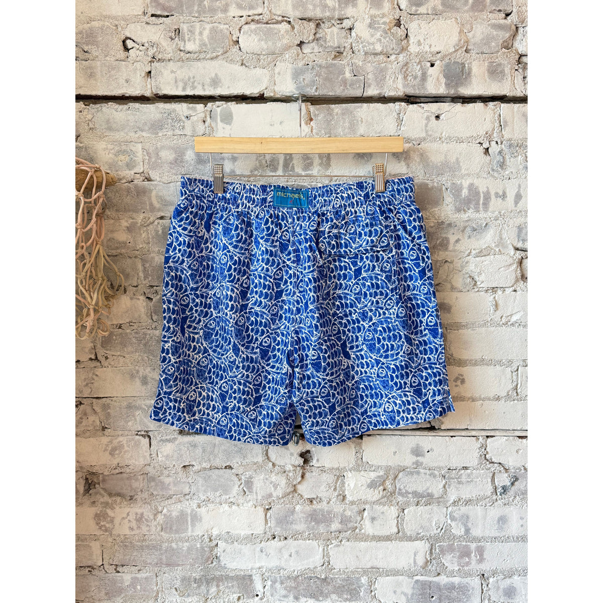 Men's cyclist liner swim trunks with abstract fish pattern in navy by Michael's Swim.