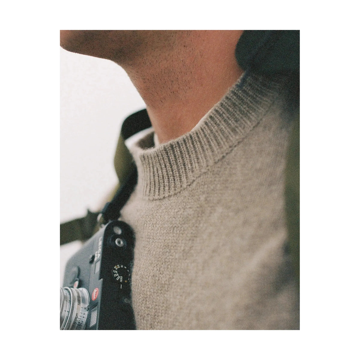 Men's Amundsen Lodge Sweater in camel, cozy knit with a classic fit, shown in a natural setting.