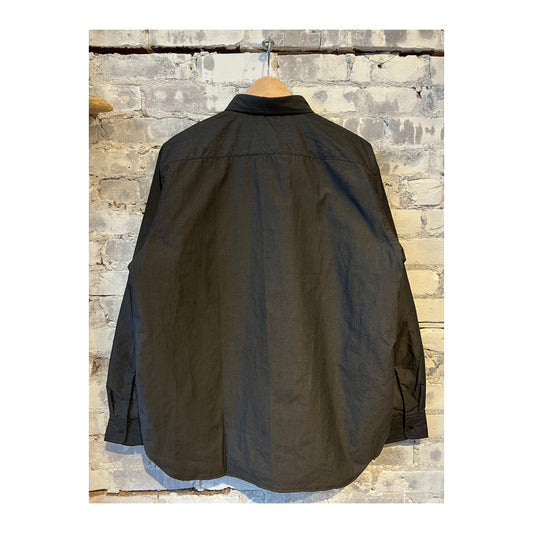 Men's gray nanamica insulation shirt jacket with a relaxed fit, featuring a stand collar and button front for casual warmth.