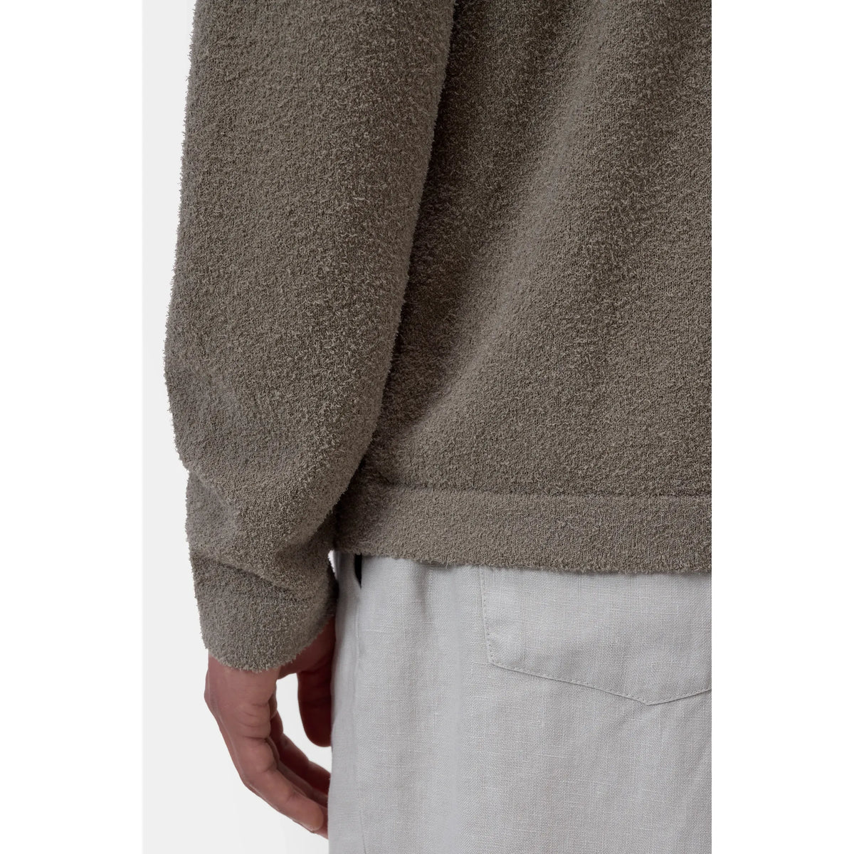 Men's organic cotton cardigan in pebble green by Closed Men's, featuring a soft, cozy knit with a button-up front and ribbed cuffs.