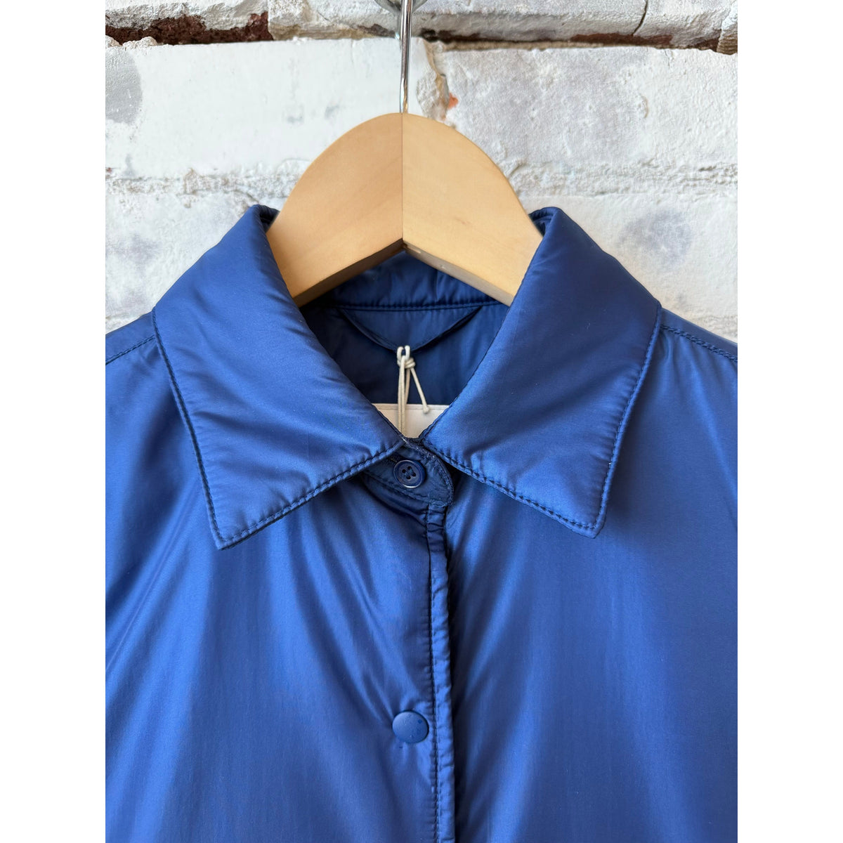 Light blue women's padded nylon overshirt by Aspesi, shown with a relaxed fit and padded design for casual, lightweight warmth.